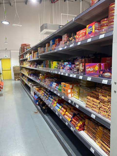 Grocery and household essentials on shelves at Namaste Bazaar Cambridge
