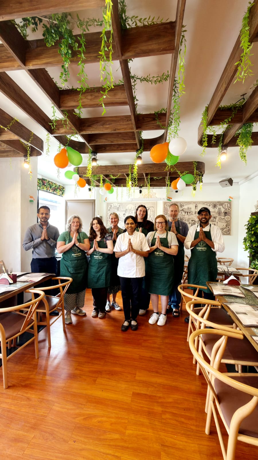 Guests learning Indian vegetarian cooking at Namaste Cookery School Cambridge